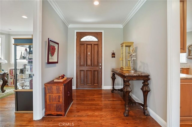entrance foyer with wood finished floors, crown molding, baseboards, and recessed lighting