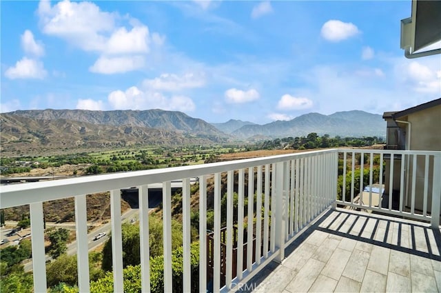 balcony featuring a mountain view