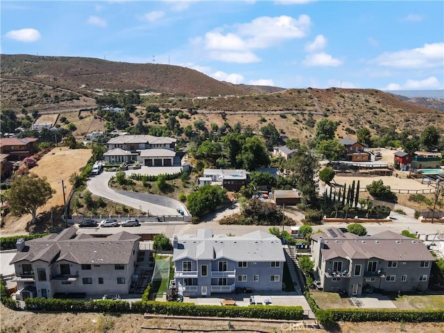 aerial perspective of suburban area with a mountainous background