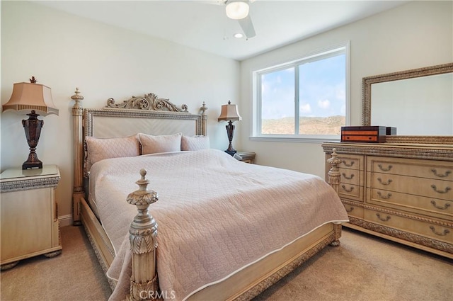 bedroom featuring light colored carpet, a ceiling fan, and recessed lighting