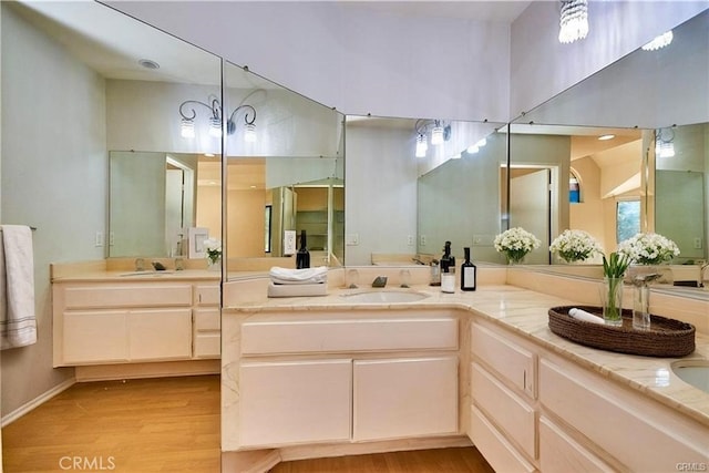 2990 Malaga Cir Unit C, Diamond Bar, CA 91765 - full bathroom with wood finished floors, double vanity, and baseboards