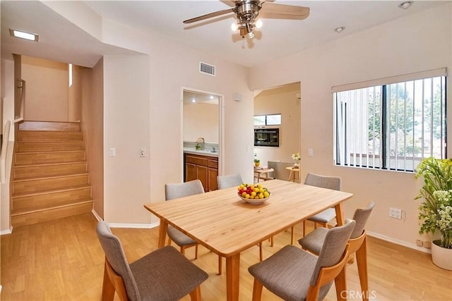 2990 Malaga Cir Unit C, Diamond Bar, CA 91765 - dining area with stairs, light wood-style floors, a ceiling fan, and baseboards