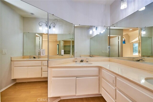 2990 Malaga Cir Unit C, Diamond Bar, CA 91765 - full bath featuring wood finished floors, double vanity, and baseboards