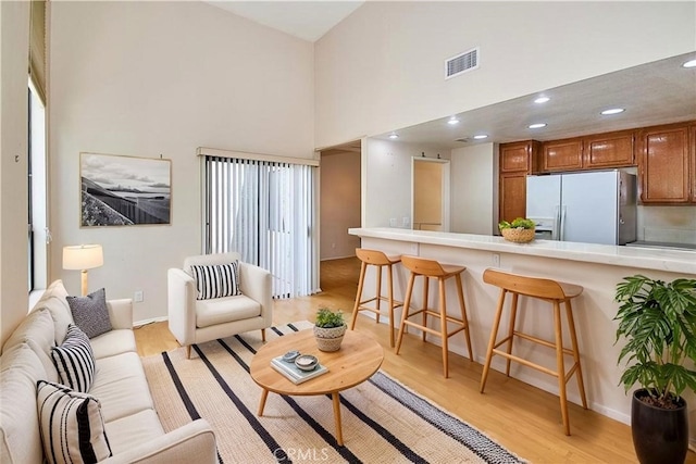 2990 Malaga Cir Unit C, Diamond Bar, CA 91765 - living area featuring a towering ceiling, light wood finished floors, recessed lighting, and baseboards