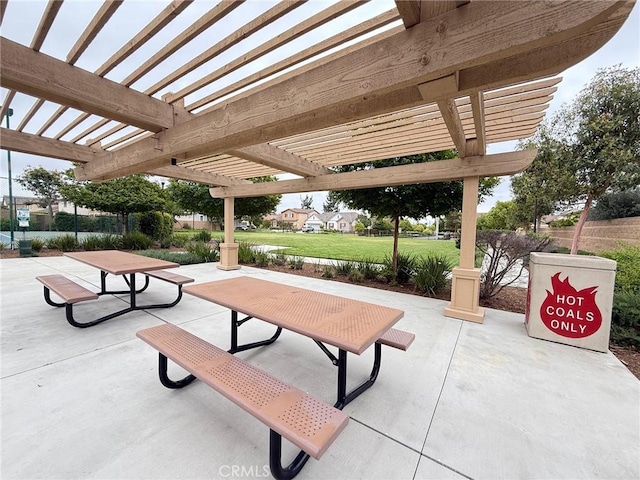 view of community with a patio and a pergola