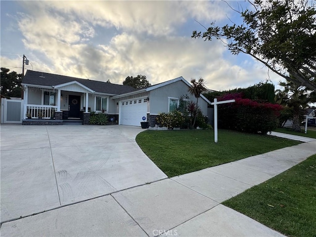14825 Cranbrook Ave, Hawthorne, CA 90250 - view of front of home with covered porch, a front yard, an attached garage, concrete driveway, and stucco siding