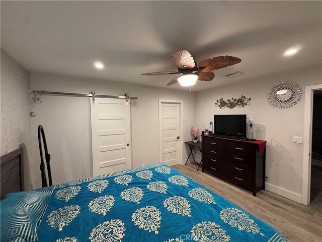 14825 Cranbrook Ave, Hawthorne, CA 90250 - bedroom featuring a barn door, light wood-style floors, a ceiling fan, baseboards, and recessed lighting