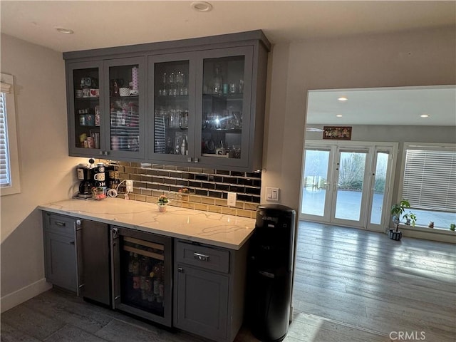 14825 Cranbrook Ave, Hawthorne, CA 90250 - indoor wet bar featuring wood finished floors, decorative backsplash, wine cooler, recessed lighting, and baseboards