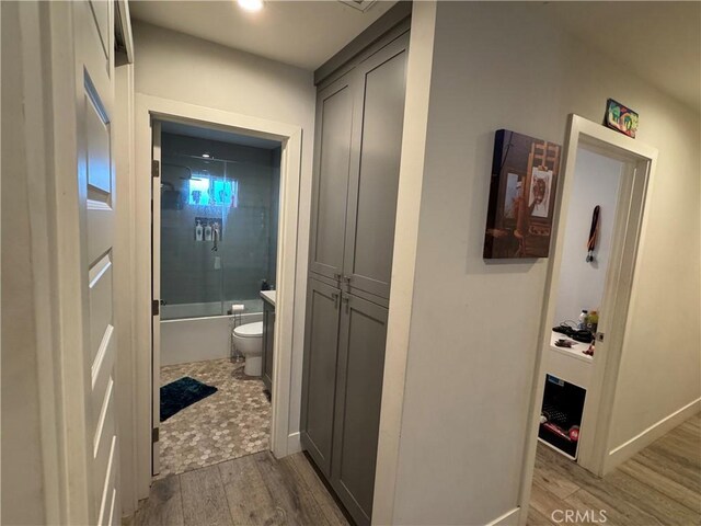 14825 Cranbrook Ave, Hawthorne, CA 90250 - hallway with light wood finished floors and baseboards