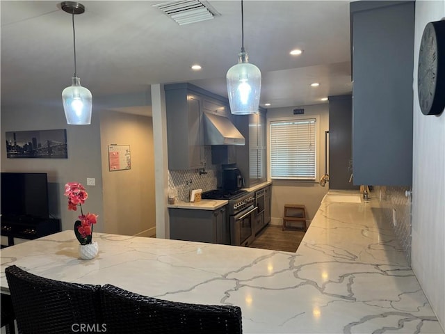 14825 Cranbrook Ave, Hawthorne, CA 90250 - kitchen with high end stainless steel range, wall chimney range hood, backsplash, gray cabinetry, and recessed lighting