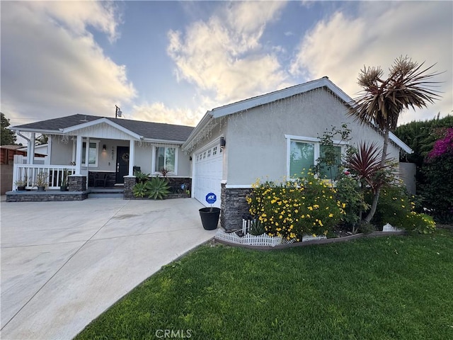 14825 Cranbrook Ave, Hawthorne, CA 90250 - view of front of property featuring a porch, stone siding, a garage, driveway, and a front yard
