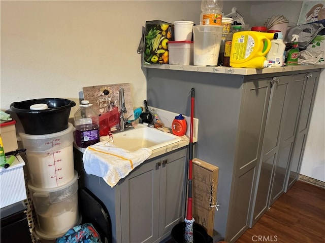 14825 Cranbrook Ave, Hawthorne, CA 90250 - laundry room featuring a sink and dark wood-type flooring