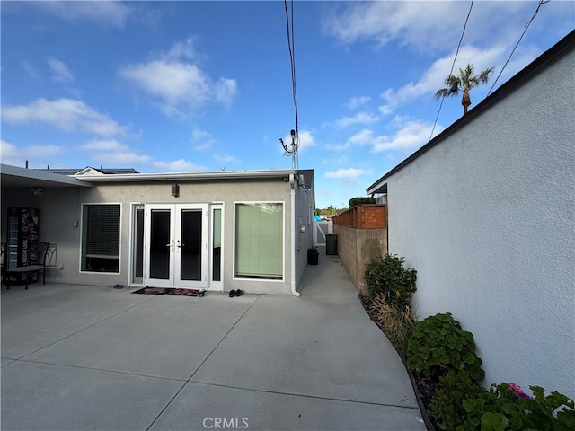 14825 Cranbrook Ave, Hawthorne, CA 90250 - back of house with french doors, stucco siding, fence, and a patio area