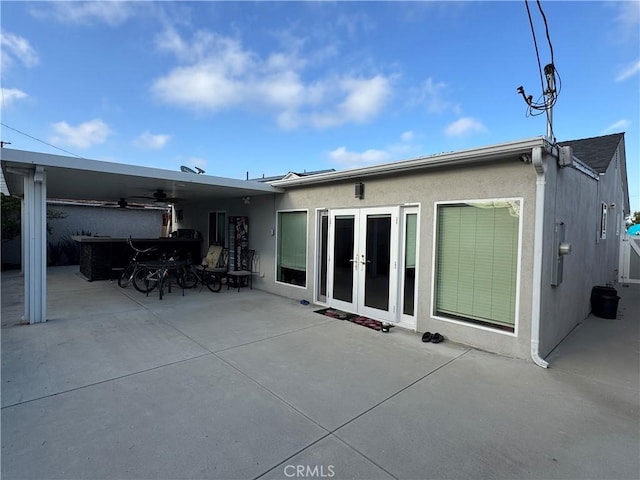 14825 Cranbrook Ave, Hawthorne, CA 90250 - back of property featuring french doors, a patio area, ceiling fan, and stucco siding