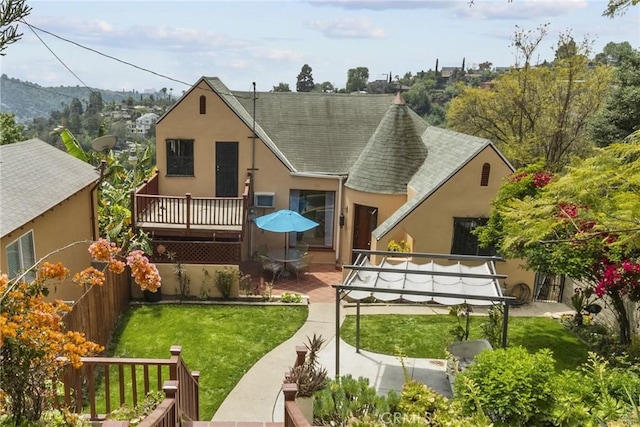 641 Sunnyhill Dr, Los Angeles, CA 90065 - rear view of property featuring stucco siding, roof with shingles, and a deck