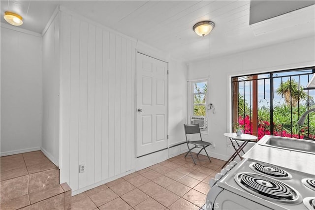 641 Sunnyhill Dr, Los Angeles, CA 90065 - kitchen with range with electric cooktop, a sink, and light tile patterned flooring