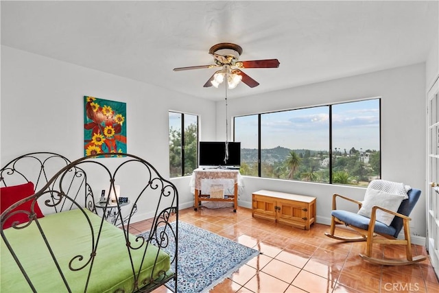 641 Sunnyhill Dr, Los Angeles, CA 90065 - bedroom with multiple windows, baseboards, light tile patterned floors, and a ceiling fan