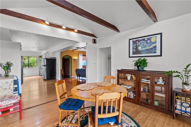 641 Sunnyhill Dr, Los Angeles, CA 90065 - dining space featuring arched walkways and light wood-type flooring