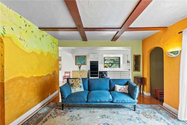 641 Sunnyhill Dr, Los Angeles, CA 90065 - living area with coffered ceiling, baseboards, arched walkways, wood finished floors, and beamed ceiling