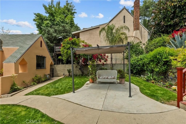 641 Sunnyhill Dr, Los Angeles, CA 90065 - back of house featuring stucco siding and a patio area
