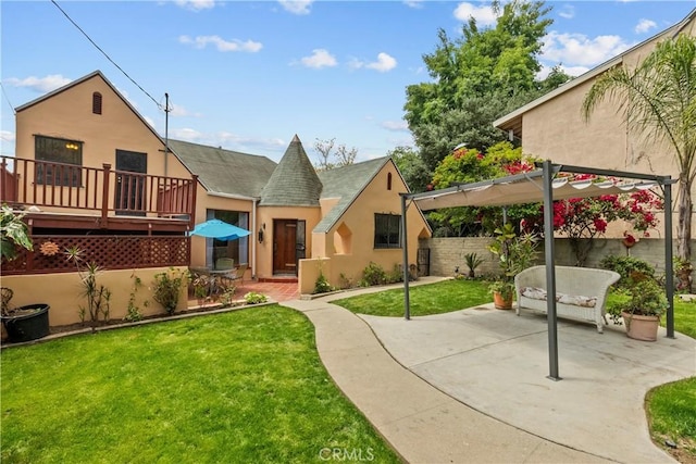 641 Sunnyhill Dr, Los Angeles, CA 90065 - back of property with stucco siding, a patio, and roof with shingles