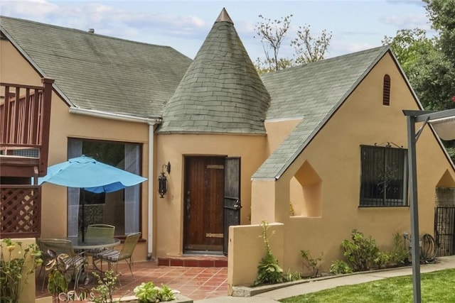 641 Sunnyhill Dr, Los Angeles, CA 90065 - view of front of house with stucco siding, roof with shingles, and a patio area