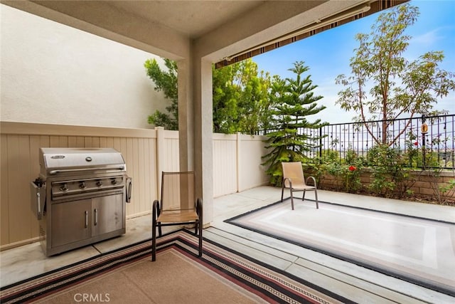 view of patio featuring fence