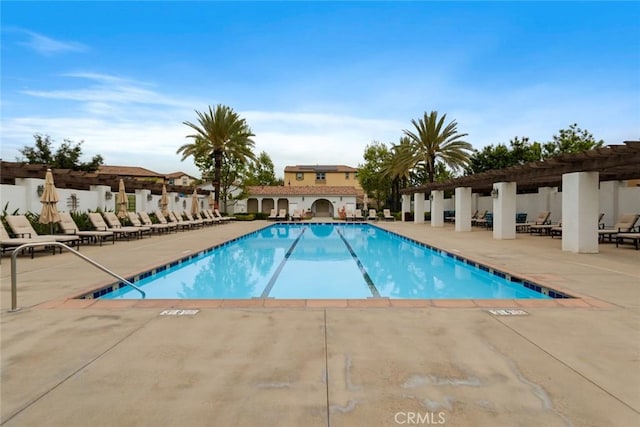 community pool featuring a patio and a pergola