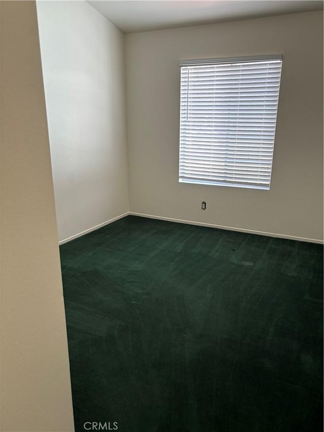 5314 Carlo Ct, Palmdale, CA 93552 - spare room with dark carpet and baseboards