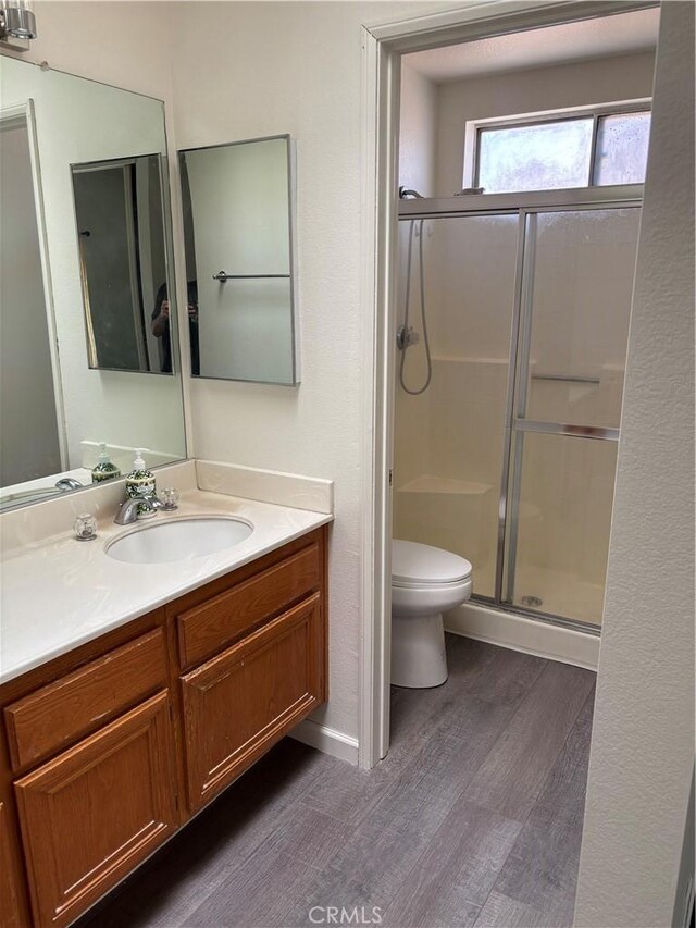 5314 Carlo Ct, Palmdale, CA 93552 - bathroom with wood finished floors, vanity, and a stall shower