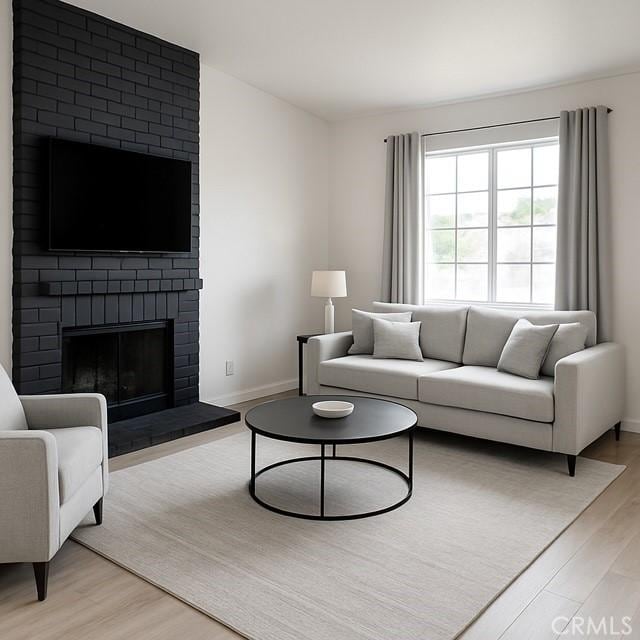 5314 Carlo Ct, Palmdale, CA 93552 - living room with light wood finished floors and a fireplace