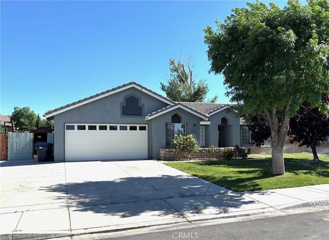 5314 Carlo Ct, Palmdale, CA 93552 - ranch-style house with stucco siding, a garage, concrete driveway, and a tile roof