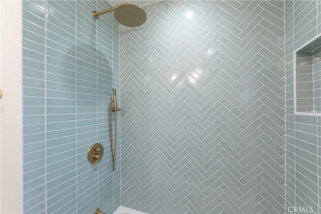 bathroom view of tiled shower
