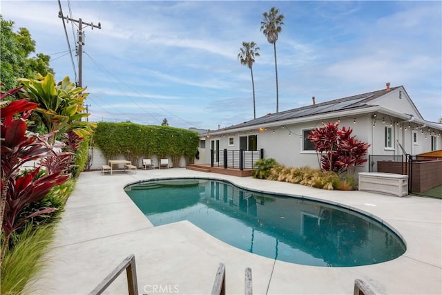 view of pool featuring a patio area and a fenced backyard