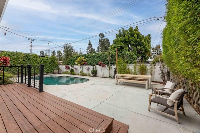 view of pool with a patio area and a fenced backyard