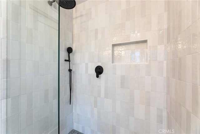 full bathroom with tiled shower