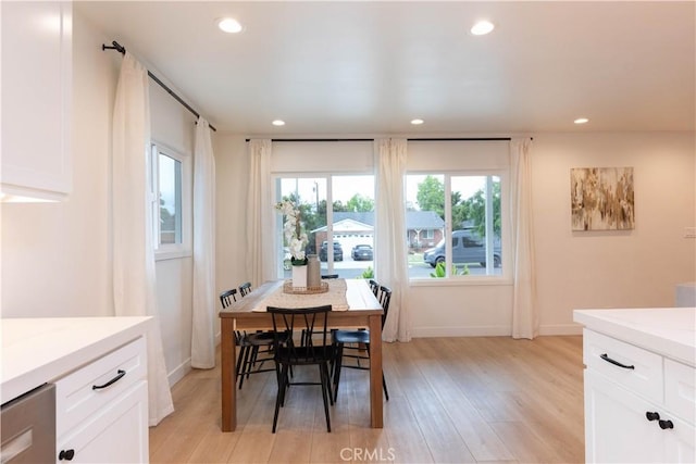 dining area featuring recessed lighting, light wood-type flooring, and baseboards