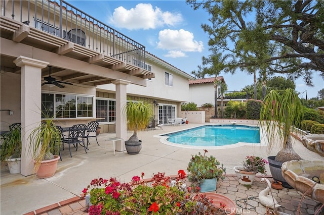 11806 Thunderbird Ave, Porter Ranch, CA 91326 - view of swimming pool with a ceiling fan, a patio area, and outdoor dining space