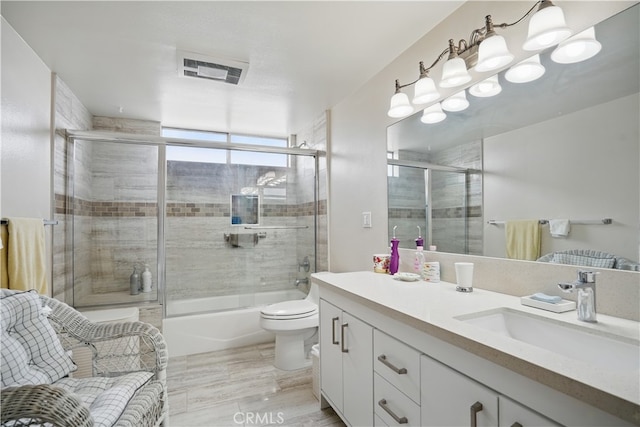 11806 Thunderbird Ave, Porter Ranch, CA 91326 - bathroom with vanity, toilet, bath / shower combo with glass door, and wood finished floors