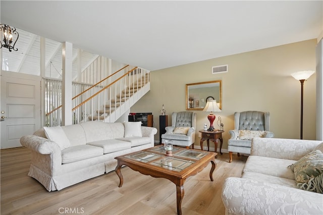 11806 Thunderbird Ave, Porter Ranch, CA 91326 - living room featuring stairs, wood finished floors, a chandelier, and baseboards