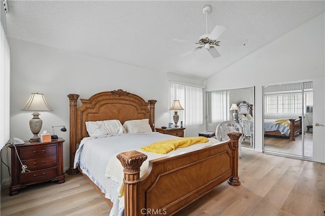 11806 Thunderbird Ave, Porter Ranch, CA 91326 - bedroom with light wood-type flooring, high vaulted ceiling, a ceiling fan, a textured ceiling, and multiple closets