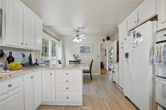 11806 Thunderbird Ave, Porter Ranch, CA 91326 - kitchen featuring white appliances, white cabinetry, a ceiling fan, light wood-style floors, and backsplash