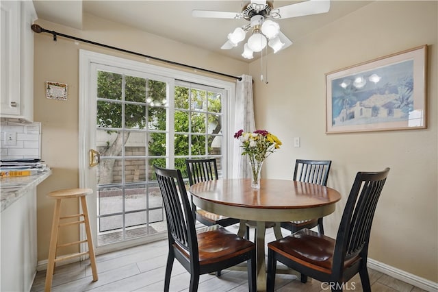 11806 Thunderbird Ave, Porter Ranch, CA 91326 - dining area featuring ceiling fan, baseboards, and light wood-type flooring