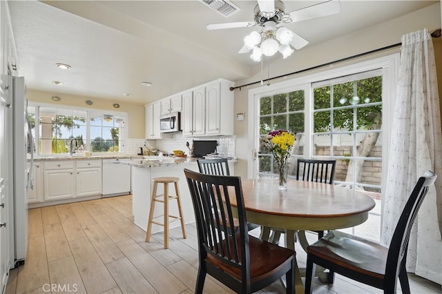 11806 Thunderbird Ave, Porter Ranch, CA 91326 - dining area featuring ceiling fan and light wood finished floors