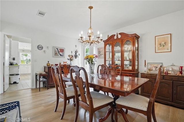 11806 Thunderbird Ave, Porter Ranch, CA 91326 - dining area with a chandelier and light wood-style flooring