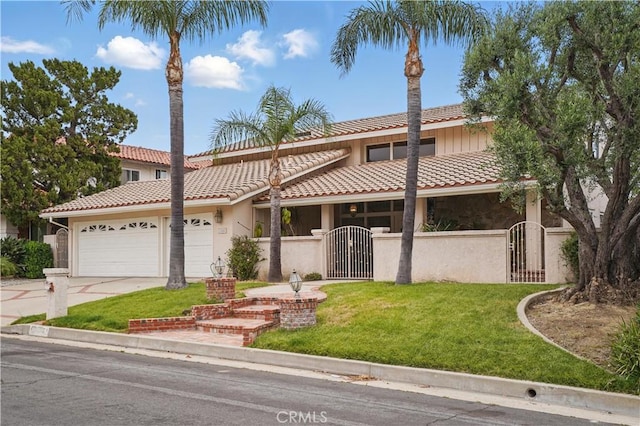 11806 Thunderbird Ave, Porter Ranch, CA 91326 - view of front of property featuring a gate, concrete driveway, a garage, and a tile roof