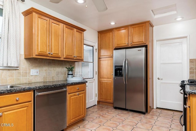 5627 Huddart Ave, Arcadia, CA 91006 - kitchen with stainless steel appliances, backsplash, brown cabinetry, dark stone counters, and a ceiling fan