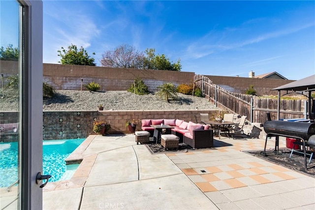 view of patio / terrace featuring a fenced backyard, an outdoor hangout area, and grilling area