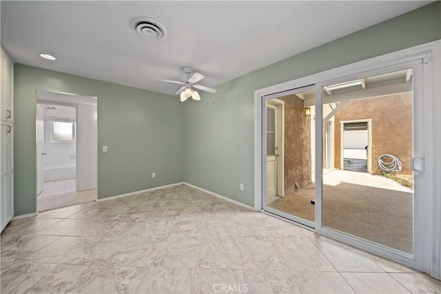 unfurnished bedroom with baseboards, ceiling fan, and ensuite bathroom