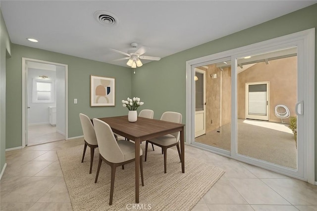 dining space with light tile patterned floors, a ceiling fan, baseboards, and recessed lighting